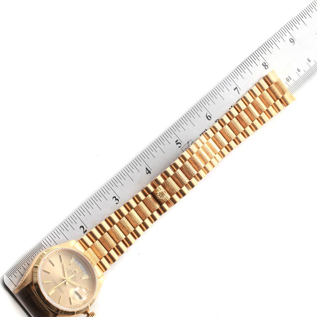 The image shows a partial view of a Rolex President 18248 Men
s Yellow Gold Champagne Dial 18248 Men
s Yellow Gold Champagne Dial model watch, including the face and bracelet, measured against a ruler.