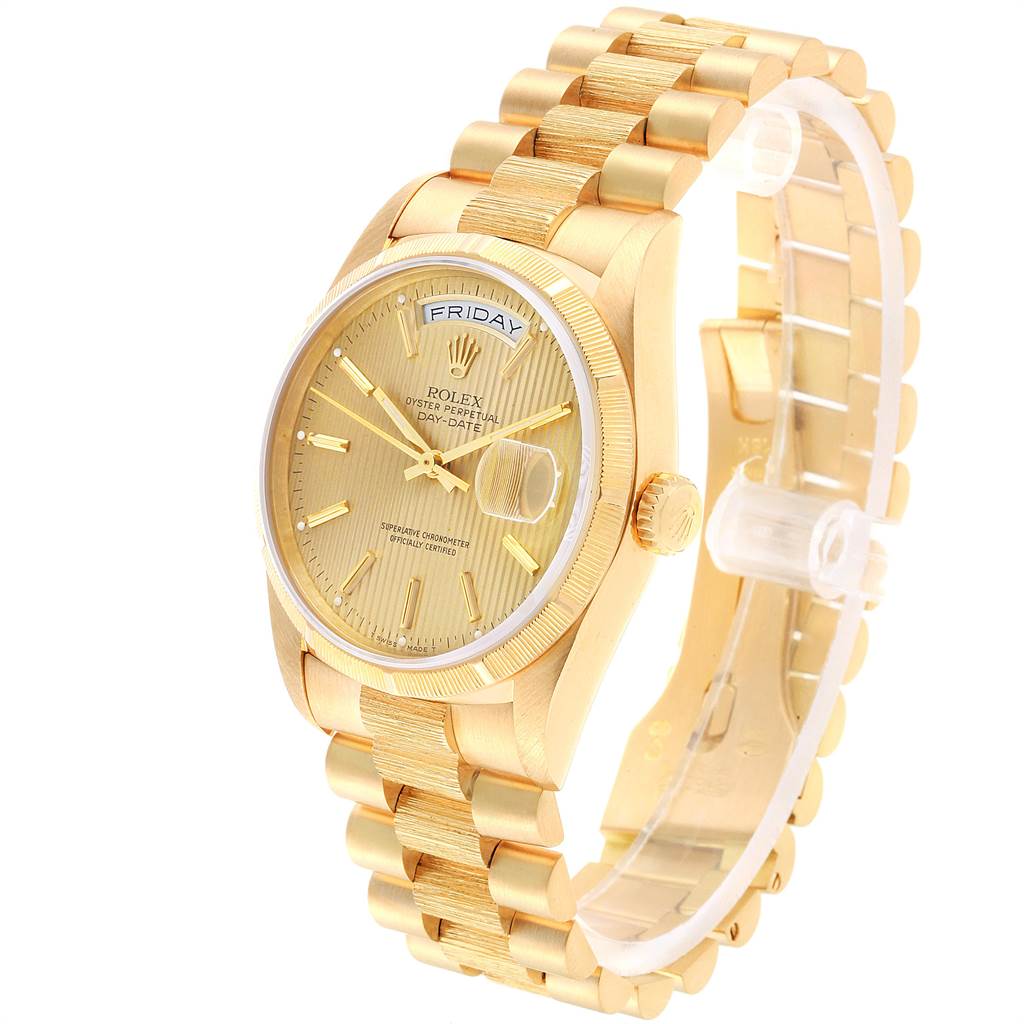 The Rolex President 18248 Men
s Yellow Gold Champagne Dial 18248 Men
s Yellow Gold Champagne Dial model watch is shown at an angle, displaying its gold dial, case, band, and day-date functions.