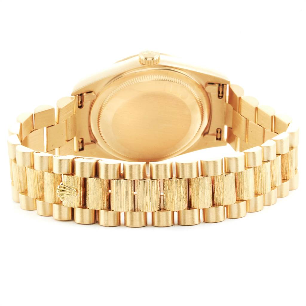 This image shows the backside and bracelet of a Rolex President 18248 Men
s Yellow Gold Champagne Dial 18248 Men
s Yellow Gold Champagne Dial model watch at a slight angle.