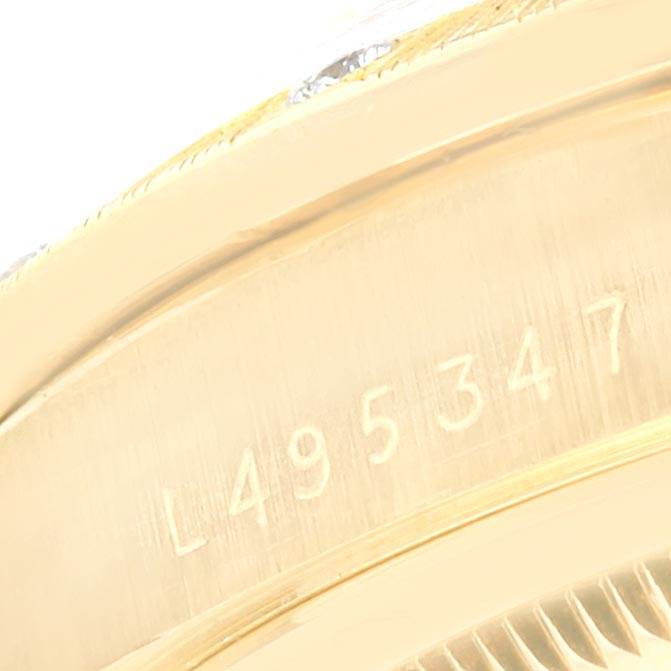 The image shows a close-up of the serial number on the case back edge of a Rolex President 18308 Men
s Yellow Gold Champagne Dial 18308 Men
s Yellow Gold Champagne Dial model watch.