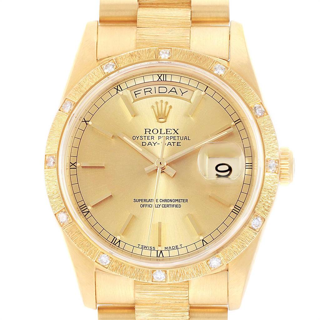 This image shows a front-facing angle of a Rolex President 18308 Men
s Yellow Gold Champagne Dial 18308 Men
s Yellow Gold Champagne Dial model watch, highlighting the gold dial, day-date display, and diamond markers.