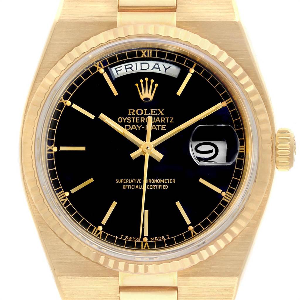 This is a close-up frontal view of the Rolex President 19018 Men
s Yellow Gold Black Dial 19018 Men
s Yellow Gold Black Dial Oysterquartz Day-Date watch, displaying its dial, bezel, and crown.