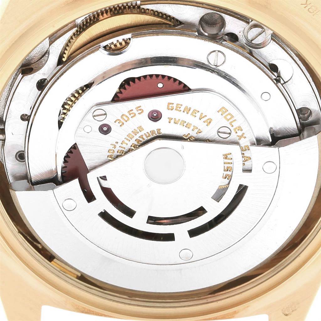 The image shows the inner mechanism of a Rolex President 18038 Men
s Yellow Gold White Dial 18038 Men
s Yellow Gold White Dial model watch, capturing the intricate parts and Rolex branding.