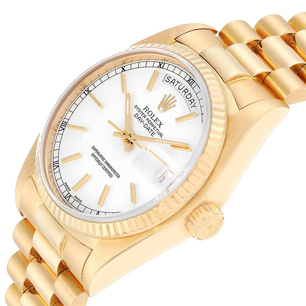 The image shows a close-up of a Rolex President 18038 Men
s Yellow Gold White Dial 18038 Men
s Yellow Gold White Dial model watch, focusing on the face, crown, and part of the bracelet at an angled view.