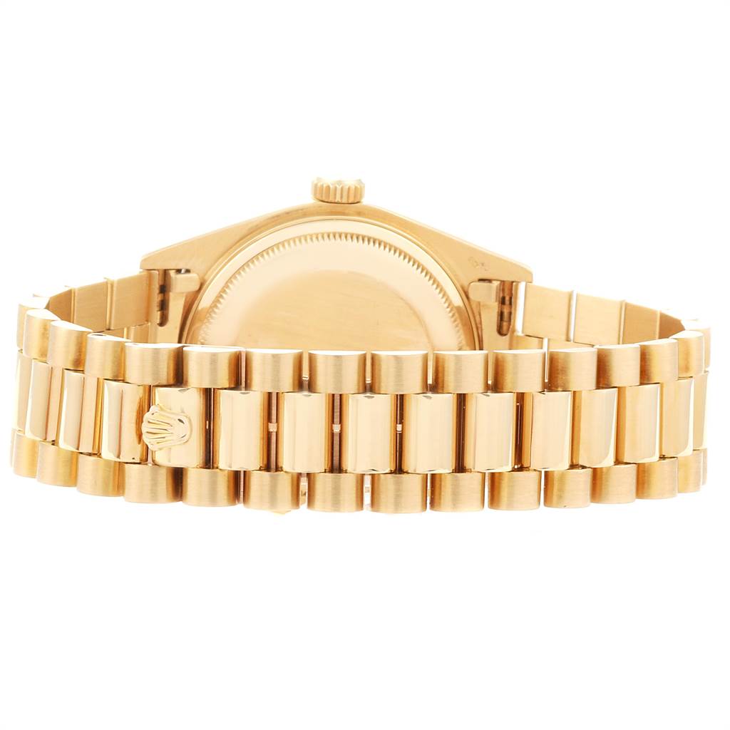 The image shows the backside and bracelet of a Rolex President 18038 Men
s Yellow Gold White Dial 18038 Men
s Yellow Gold White Dial model watch, highlighting its clasp and link design.