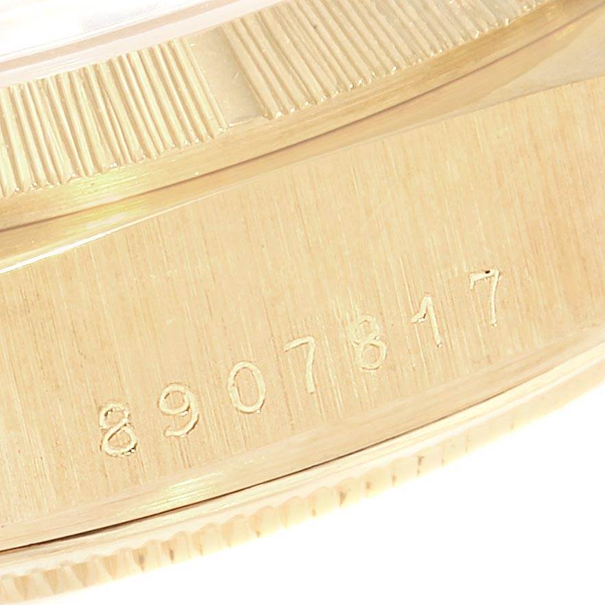 The image shows a close-up of the serial number engraved on the side of a Rolex President 18078 Men
s Yellow Gold Brown Dial 18078 Men
s Yellow Gold Brown Dial model watch.