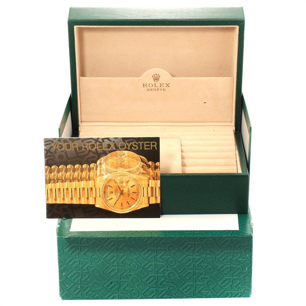 The image shows a Rolex President 18078 Men
s Yellow Gold Brown Dial 18078 Men
s Yellow Gold Brown Dial model watch box with an open interior and an instruction booklet.