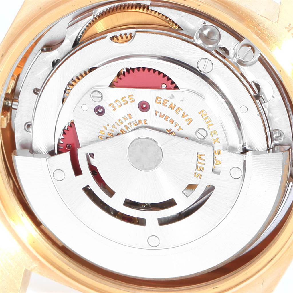 The image shows a close-up of the internal mechanical movement of a Rolex President 18078 Men
s Yellow Gold Brown Dial 18078 Men
s Yellow Gold Brown Dial watch.