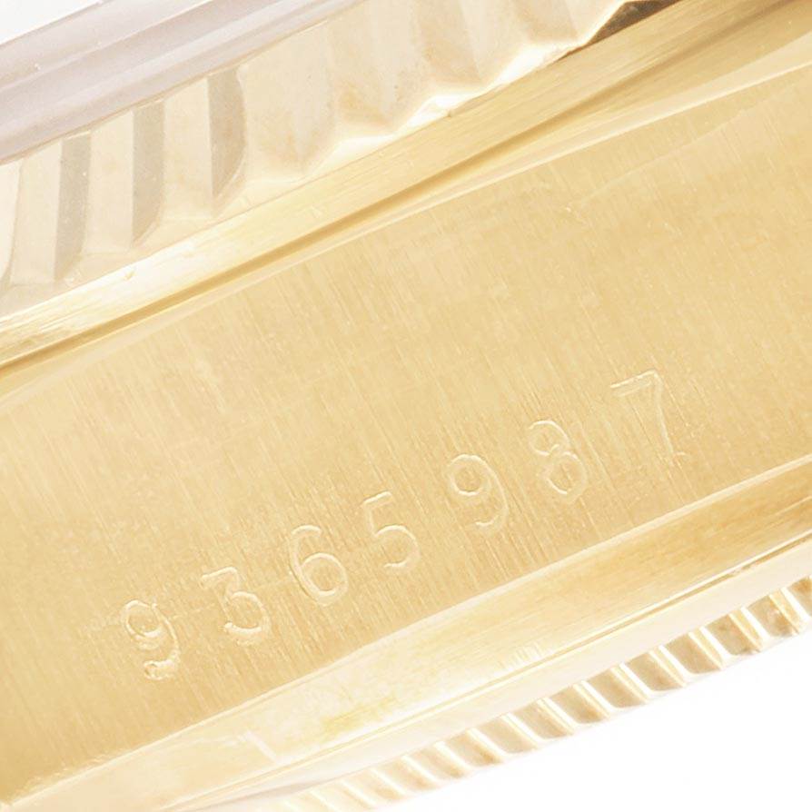 The image shows a close-up angle of the side of the Rolex President 18038 Men
s Yellow Gold Champagne Dial 18038 Men
s Yellow Gold Champagne Dial model, focusing on the serial number engraving.