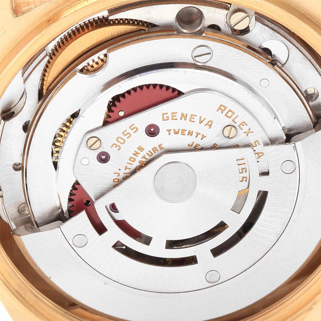 The image shows the intricate inner mechanism of the Rolex President 18078 Men
s Yellow Gold Champagne Dial 18078 Men
s Yellow Gold Champagne Dial model watch from a close-up angle.