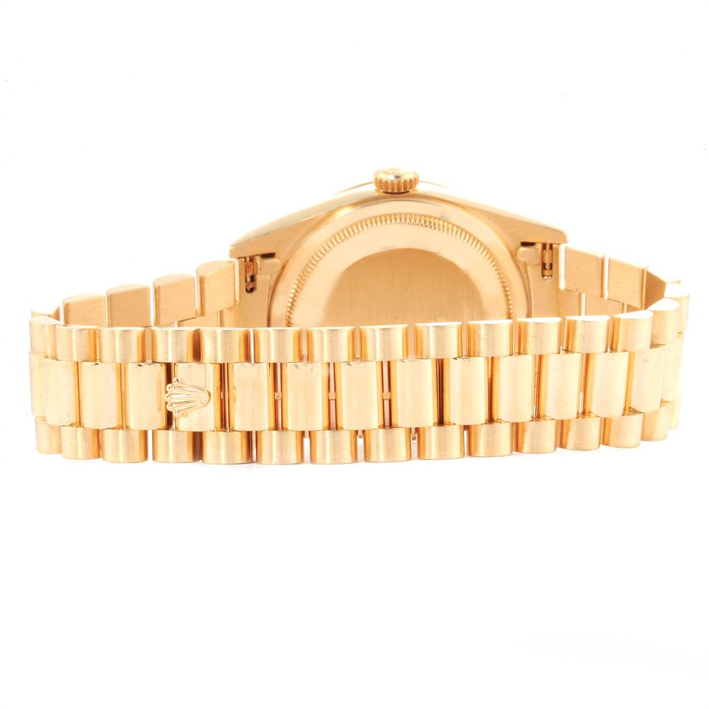 The image shows the back and bracelet of a Rolex President 18238 Men
s Yellow Gold Champagne Dial 18238 Men
s Yellow Gold Champagne Dial model watch with the crown logo visible.