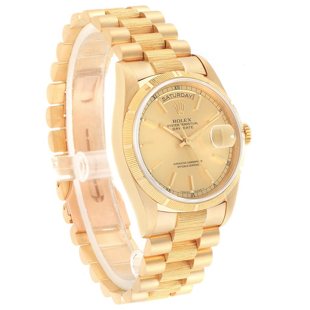 The image shows a President model by Rolex at a three-quarter angle, highlighting the gold dial, bracelet, and day-date display.