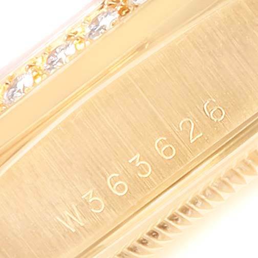 The image shows a close-up of the serial number on the side of the Rolex President 18348 Men
s Yellow Gold Champagne Dial 18348 Men
s Yellow Gold Champagne Dial watch, along with part of the bezel.
