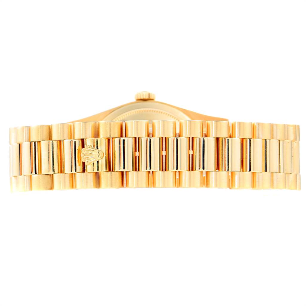 The image shows the bracelet and clasp of a Rolex President 18348 Men
s Yellow Gold Champagne Dial 18348 Men
s Yellow Gold Champagne Dial model watch from a top-down angle.