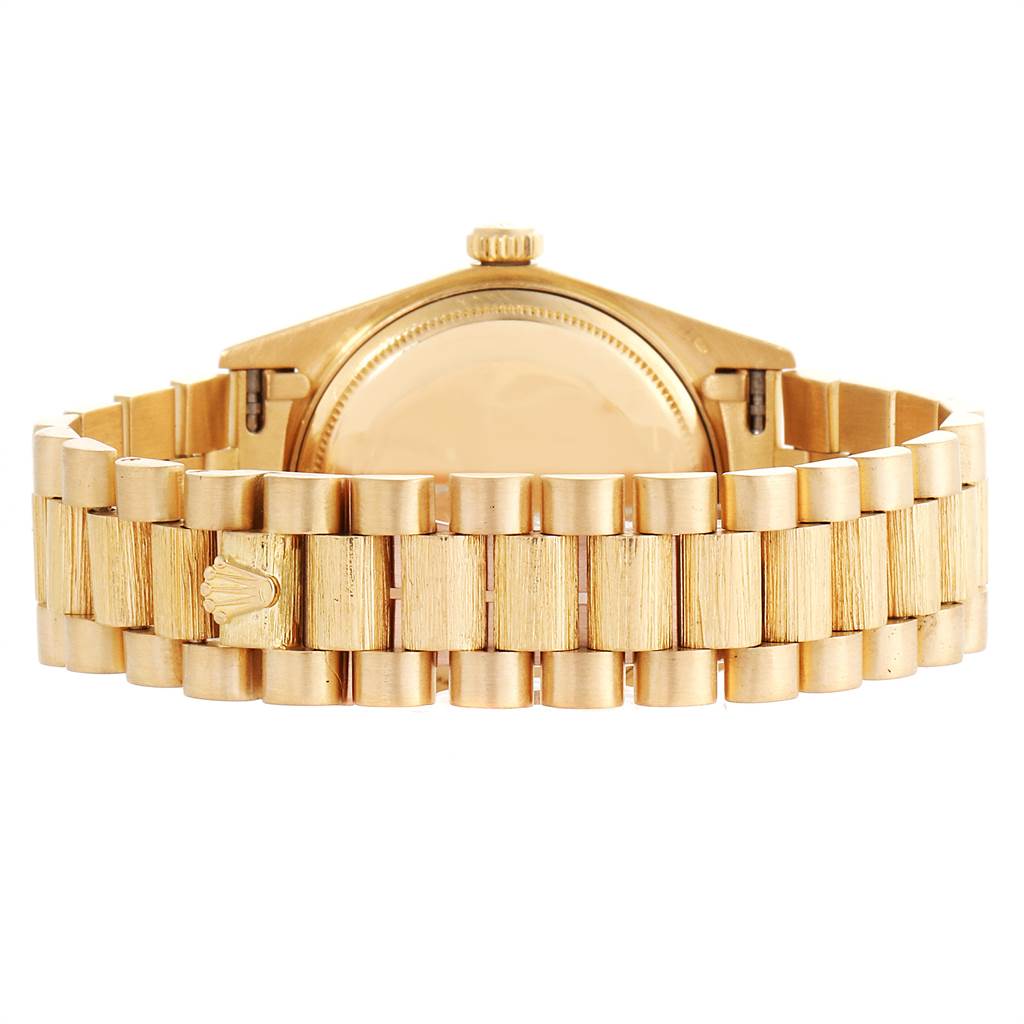 The image shows the back view of a gold Rolex President 18038 Men
s Yellow Gold Black Dial 18038 Men
s Yellow Gold Black Dial model, featuring its bracelet and clasp.