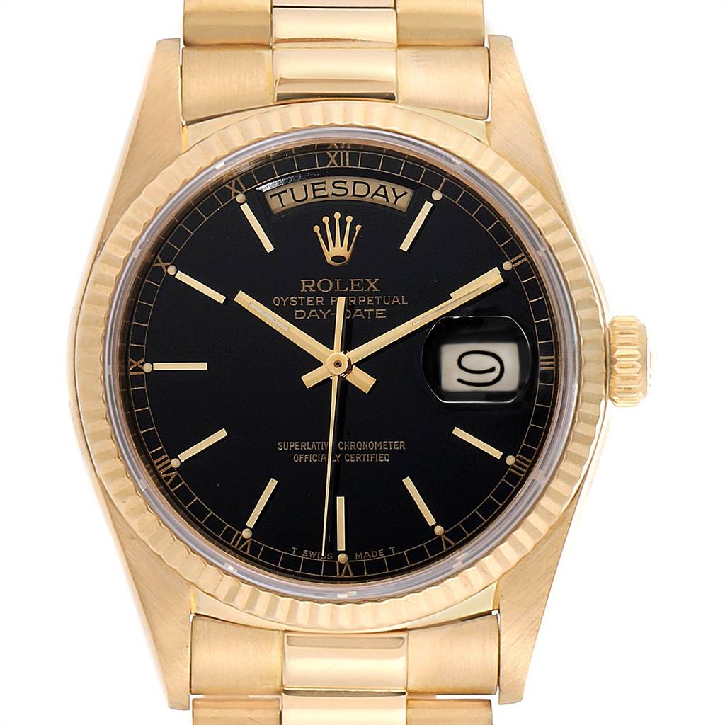 This image shows a frontal view of a Rolex President 18038 Men
s Yellow Gold Black Dial 18038 Men
s Yellow Gold Black Dial watch, highlighting the black dial, day/date display, and gold bracelet.