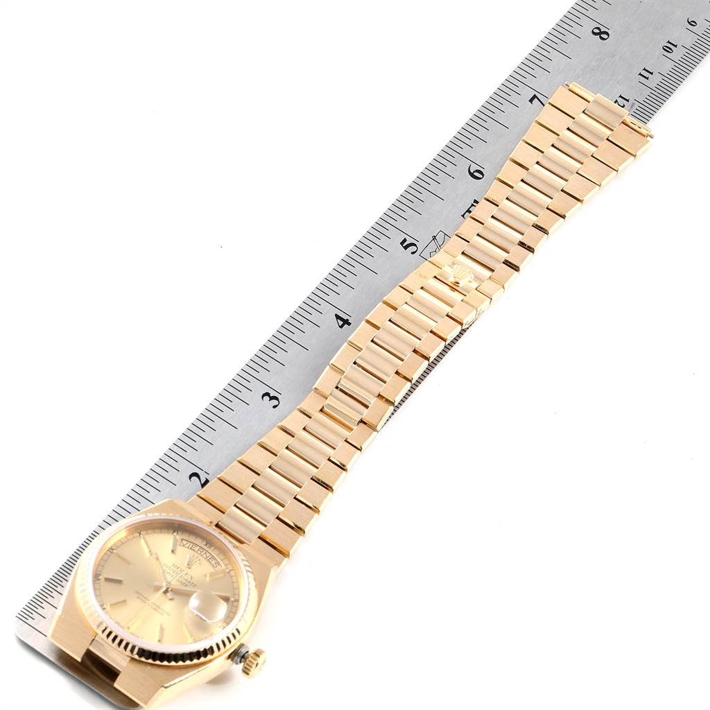 The image shows a Rolex President 19018 Men's Yellow Gold Champagne Dial 19018 Men's Yellow Gold Champagne Dial watch laid flat next to a ruler, displaying the watch face and full bracelet.