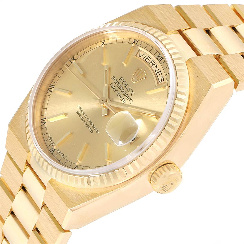 This image shows a close-up of the face and crown of the Rolex President 19018 Men's Yellow Gold Champagne Dial 19018 Men's Yellow Gold Champagne Dial model watch, displaying the dial, bezel, bracelet, and day-date feature.