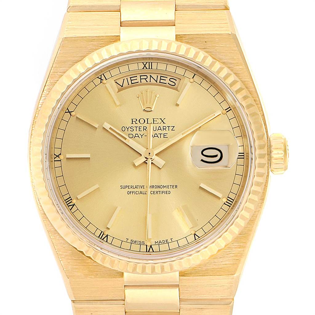 The image shows a front view of the Rolex President 19018 Men's Yellow Gold Champagne Dial 19018 Men's Yellow Gold Champagne Dial Oysterquartz Day-Date watch, highlighting its dial, hands, date, and fluted bezel.