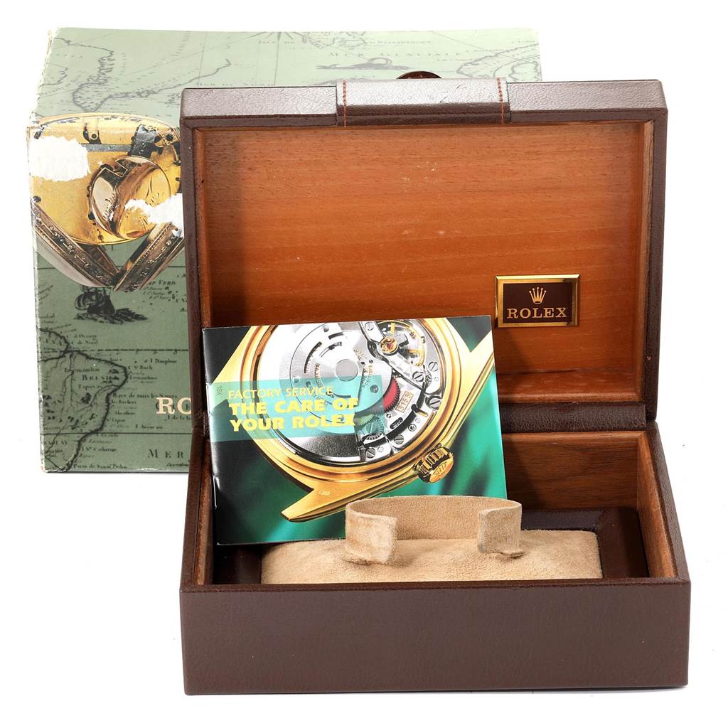 The image shows an empty Rolex box for a President model, with a service booklet inside.