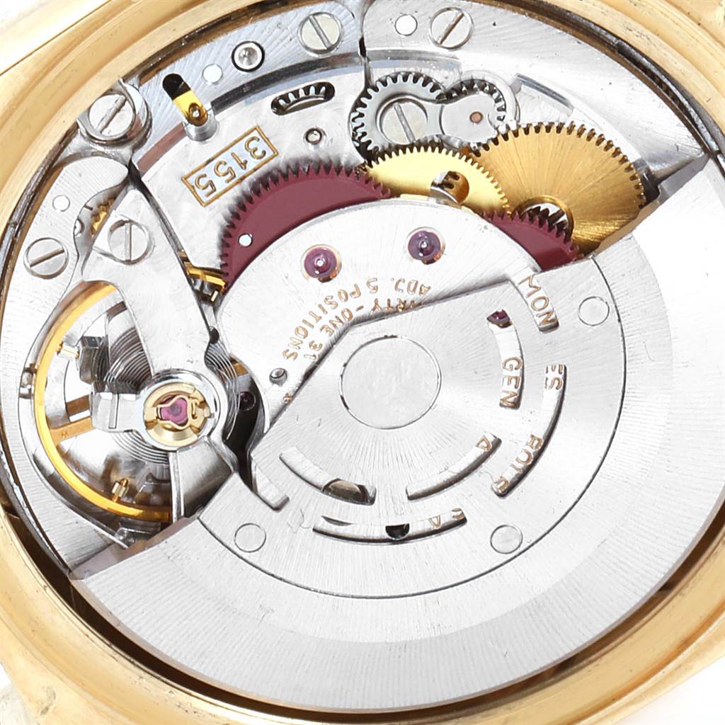 The image shows a close-up view of the movement of a Rolex President 18248 Men's Yellow Gold Champagne Dial 18248 Men's Yellow Gold Champagne Dial model watch, highlighting gears and mechanical components.