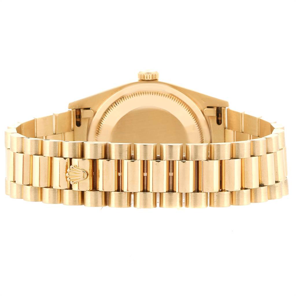 The image shows the back of a Rolex President 18238 Men
s Yellow Gold Champagne Dial 18238 Men
s Yellow Gold Champagne Dial model watch, focusing on the case back and the linked bracelet.