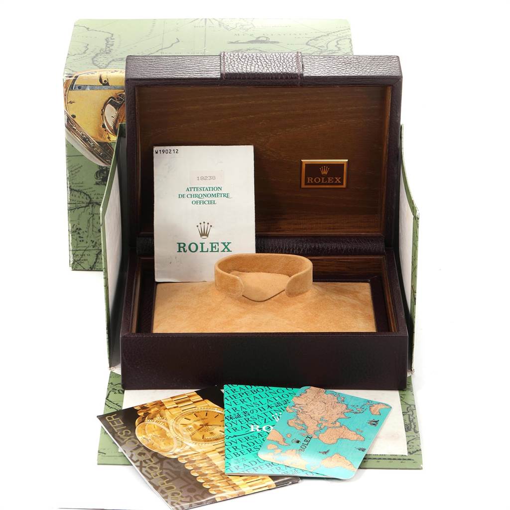 The image shows the packaging and accessories of a Rolex President 18238 Men
s Yellow Gold Champagne Dial 18238 Men
s Yellow Gold Champagne Dial model watch, including the box, manuals, and warranty papers.