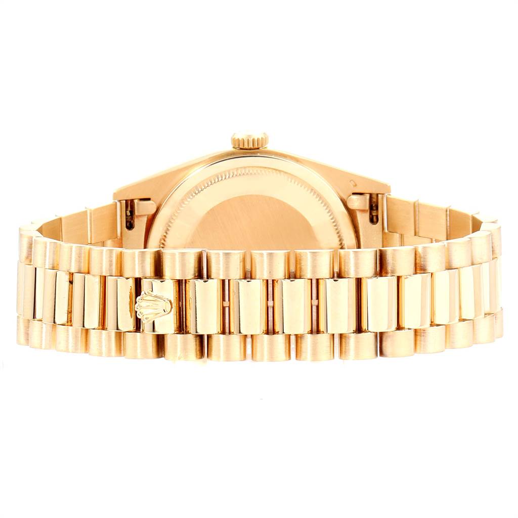 The image shows the back view of a Rolex President 18238 Men
s Yellow Gold Champagne Dial 18238 Men
s Yellow Gold Champagne Dial model watch, highlighting its gold bracelet and case back.