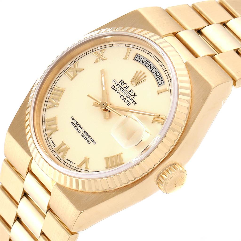 This image shows a Rolex President 19018 Men
s Yellow Gold Beige Dial 19018 Men
s Yellow Gold Beige Dial watch from an angled side view, displaying its dial, crown, and a portion of the bracelet.
