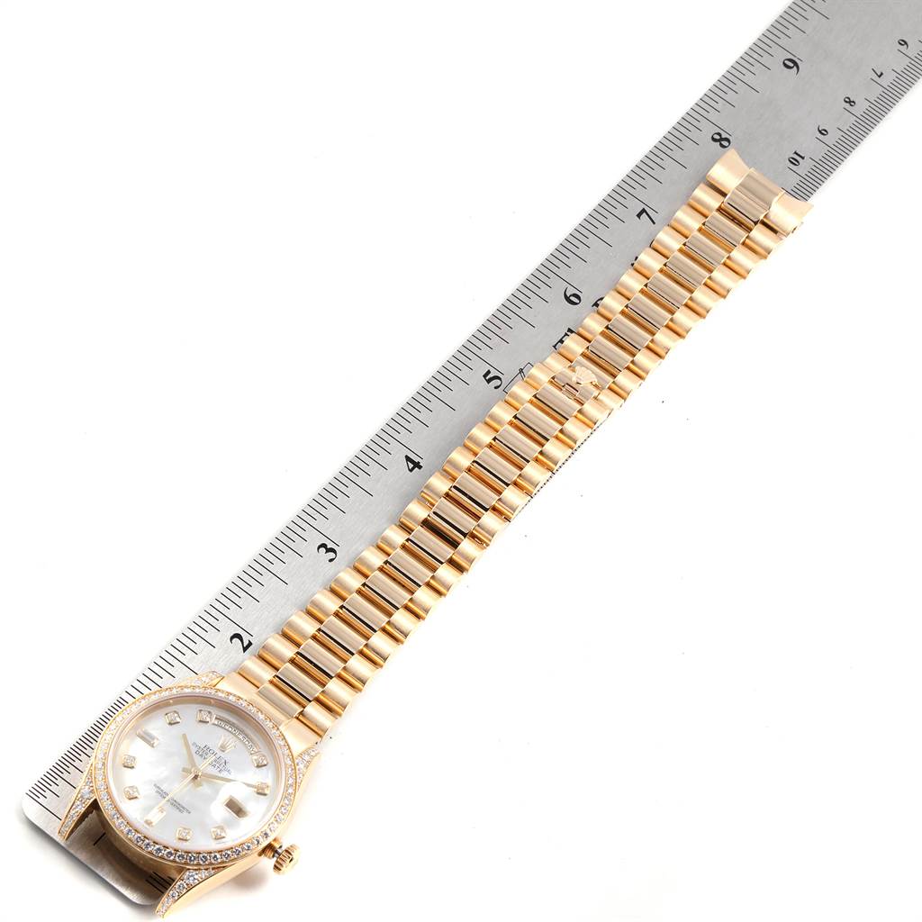 The image shows a Rolex President 118388 Men's Yellow Gold Mother of Pearl Dial 118388 Men's Yellow Gold Mother of Pearl Dial model watch from an overhead angle, with the dial, bezel, and full gold bracelet visible.