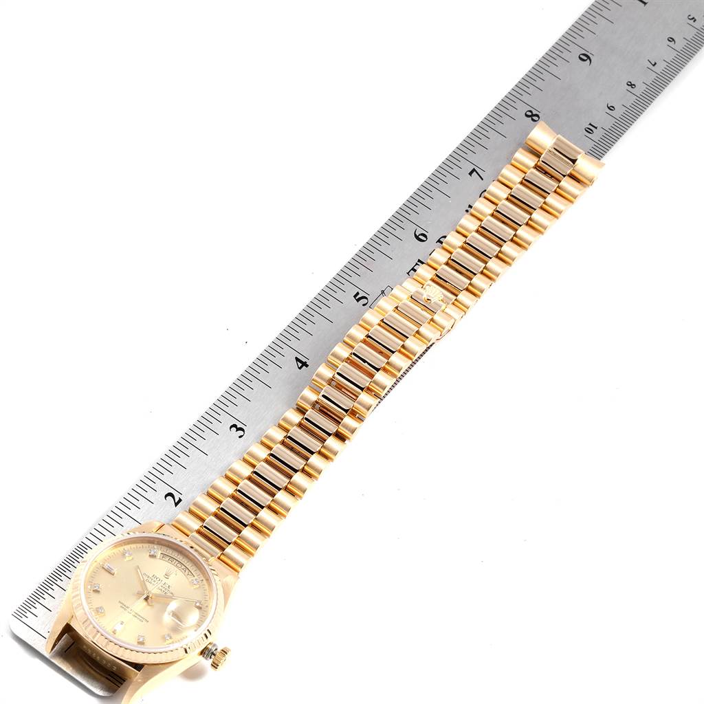 The image shows a Rolex President 18038 Men
s Yellow Gold Champagne Dial 18038 Men
s Yellow Gold Champagne Dial model watch laying flat with a ruler measuring its length.