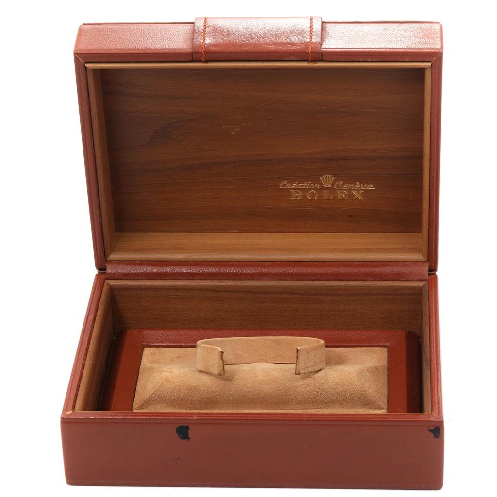 The image shows an open wooden case for the Rolex President 18038 Men
s Yellow Gold Champagne Dial 18038 Men
s Yellow Gold Champagne Dial model, including the beige cushion for the watch.