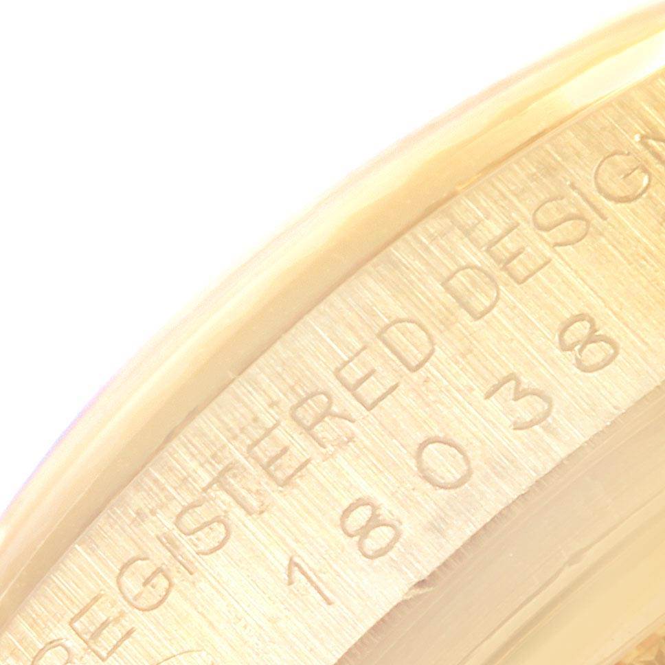 This image shows a close-up of the engraved edge of a Rolex President 18038 Men
s Yellow Gold Champagne Dial 18038 Men
s Yellow Gold Champagne Dial model watch.