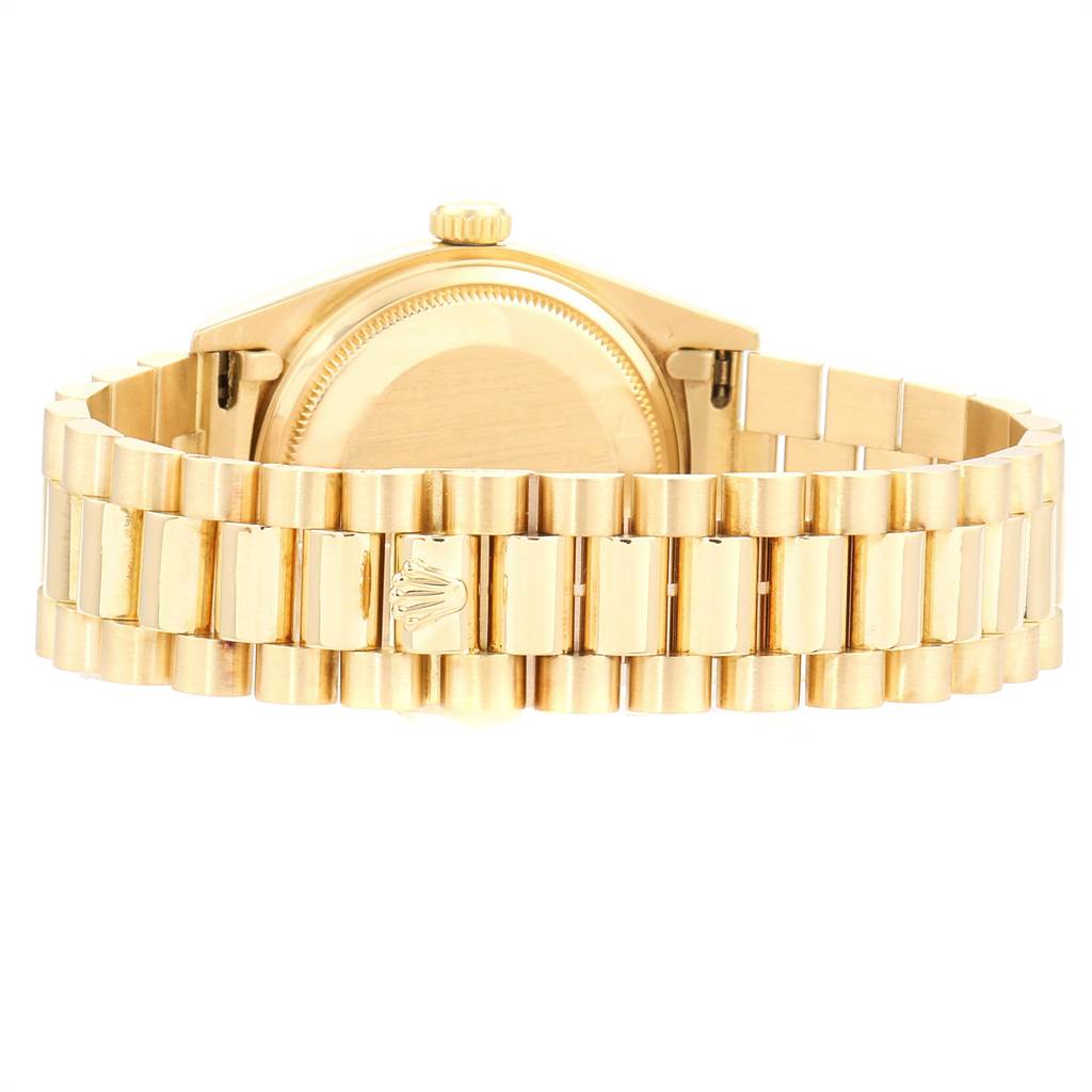 This is the rear view of a Rolex President 18038 Men
s Yellow Gold Champagne Dial 18038 Men
s Yellow Gold Champagne Dial model watch, focusing on the case back and bracelet with the Rolex logo.