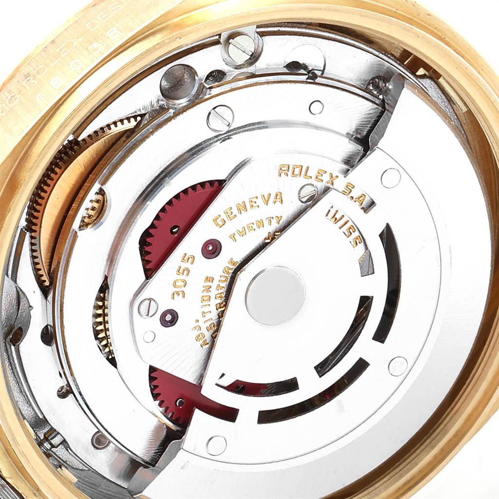 This close-up image shows the internal mechanical movement of a Rolex President 18038 Men's Yellow Gold Champagne Dial 18038 Men's Yellow Gold Champagne Dial model, revealing intricate gears and components.