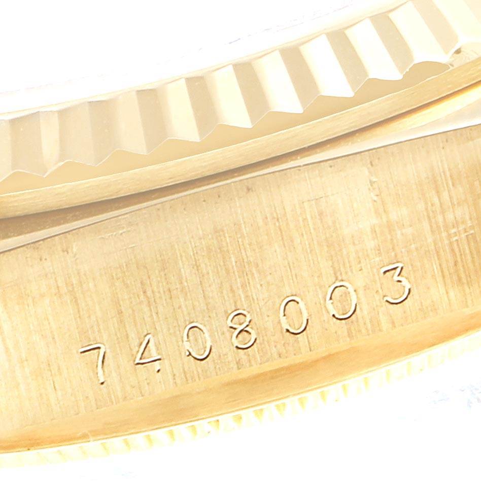 The image shows a close-up of the serial number engraved on the gold case and part of the fluted bezel of a Rolex President 18038 Men's Yellow Gold Champagne Dial 18038 Men's Yellow Gold Champagne Dial model watch.