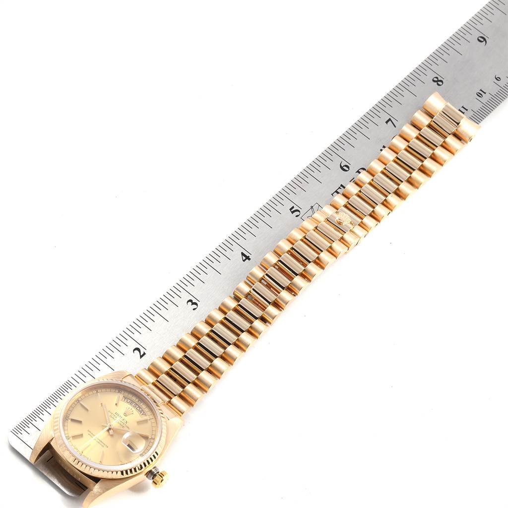 The image shows a top-view angle of a Rolex President 18038 Men's Yellow Gold Champagne Dial 18038 Men's Yellow Gold Champagne Dial model watch, highlighting the watch face, bracelet, and part of a measurement ruler.