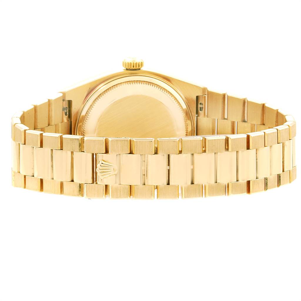 This is the back view of a Rolex President 19018 Men's Yellow Gold Black Dial 19018 Men's Yellow Gold Black Dial model watch, showcasing the bracelet and crown.