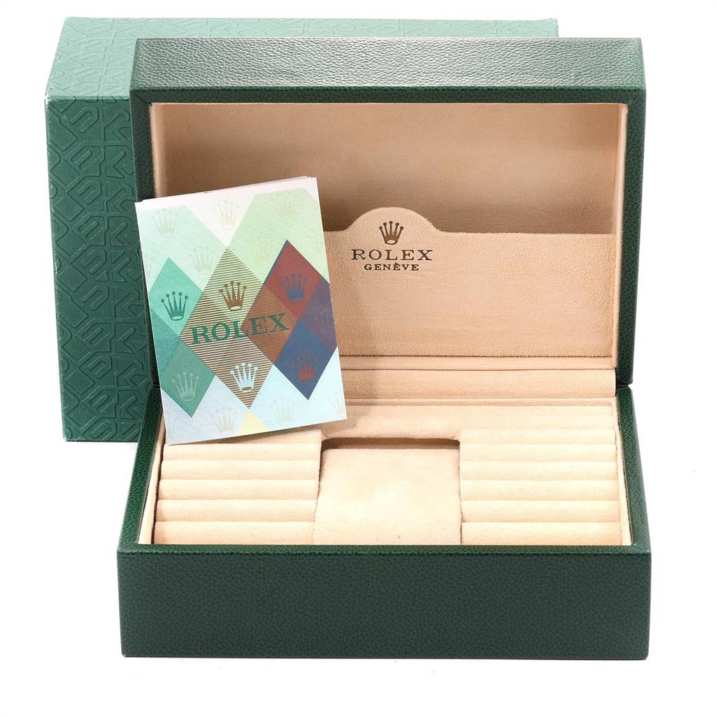 The image shows an open Rolex President 118209 Men
s White Gold White Dial 118209 Men
s White Gold White Dial model watch box with a Rolex booklet inside.