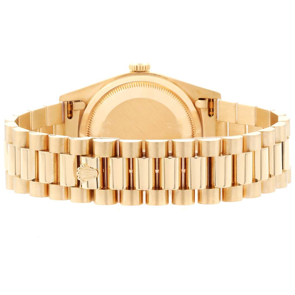 This image shows the back view of the Rolex President 18238 Men
s Yellow Gold Mother of Pearl Dial 18238 Men
s Yellow Gold Mother of Pearl Dial model watch, highlighting its band and casing.