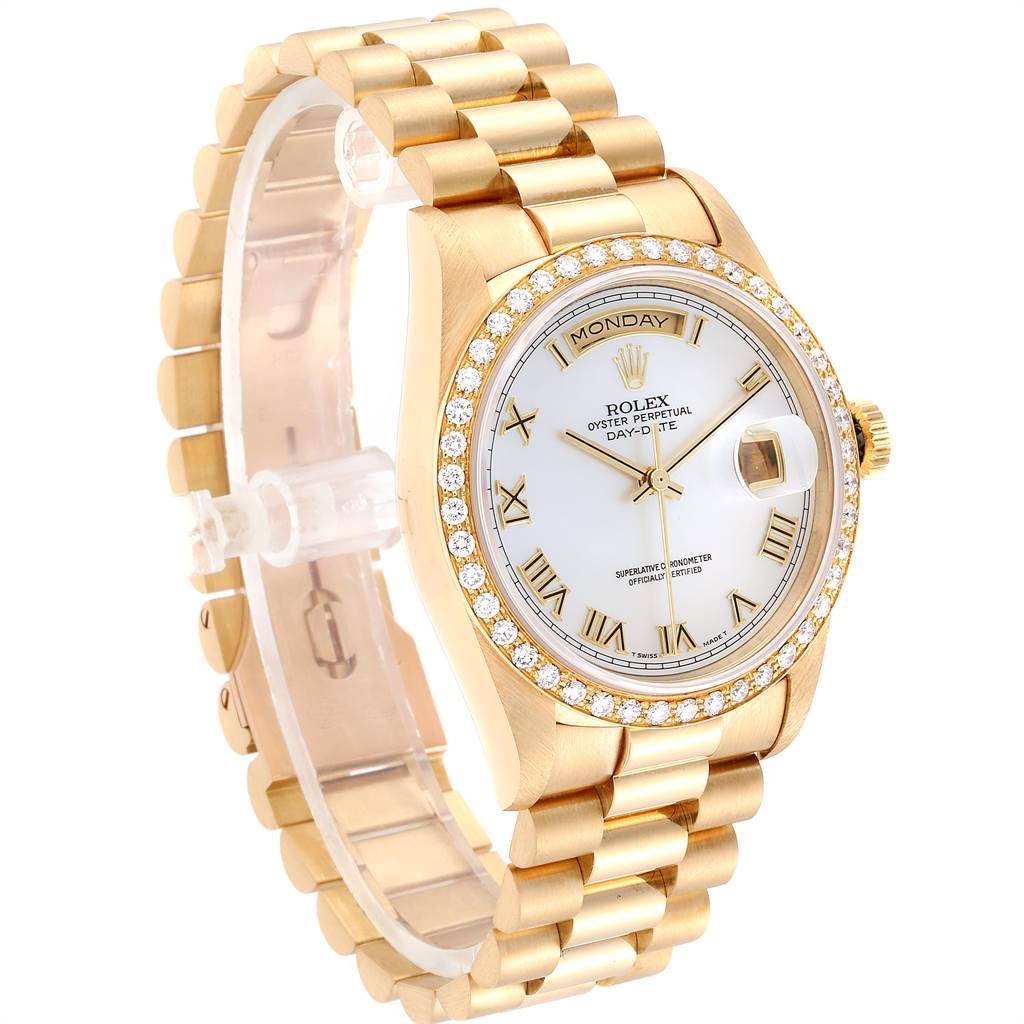 The image shows a Rolex President 18238 Men
s Yellow Gold Mother of Pearl Dial 18238 Men
s Yellow Gold Mother of Pearl Dial model watch from an angled view, highlighting its gold bracelet, diamond-encrusted bezel, and dial.