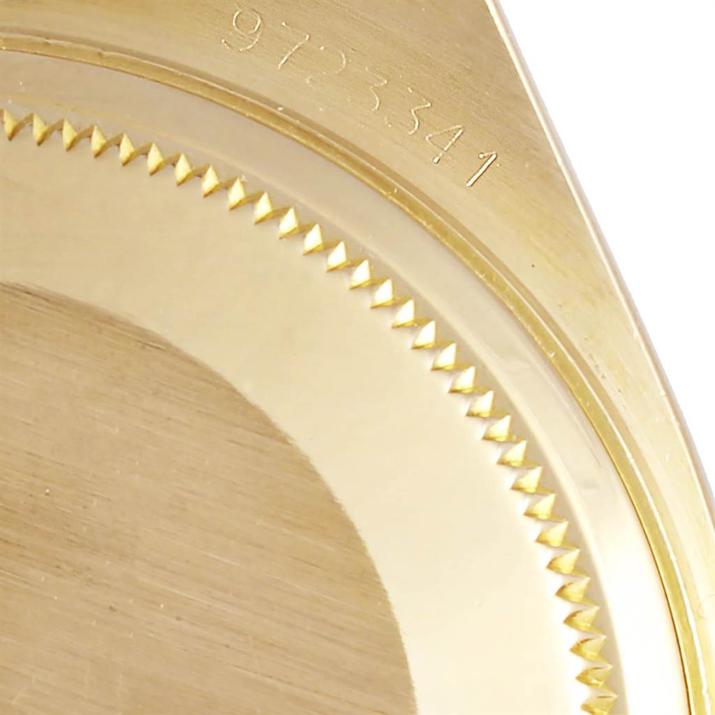 This image shows a close-up of the bezel and part of the caseback of a Rolex President 19018 Men
s Yellow Gold Champagne Dial 19018 Men
s Yellow Gold Champagne Dial model watch.