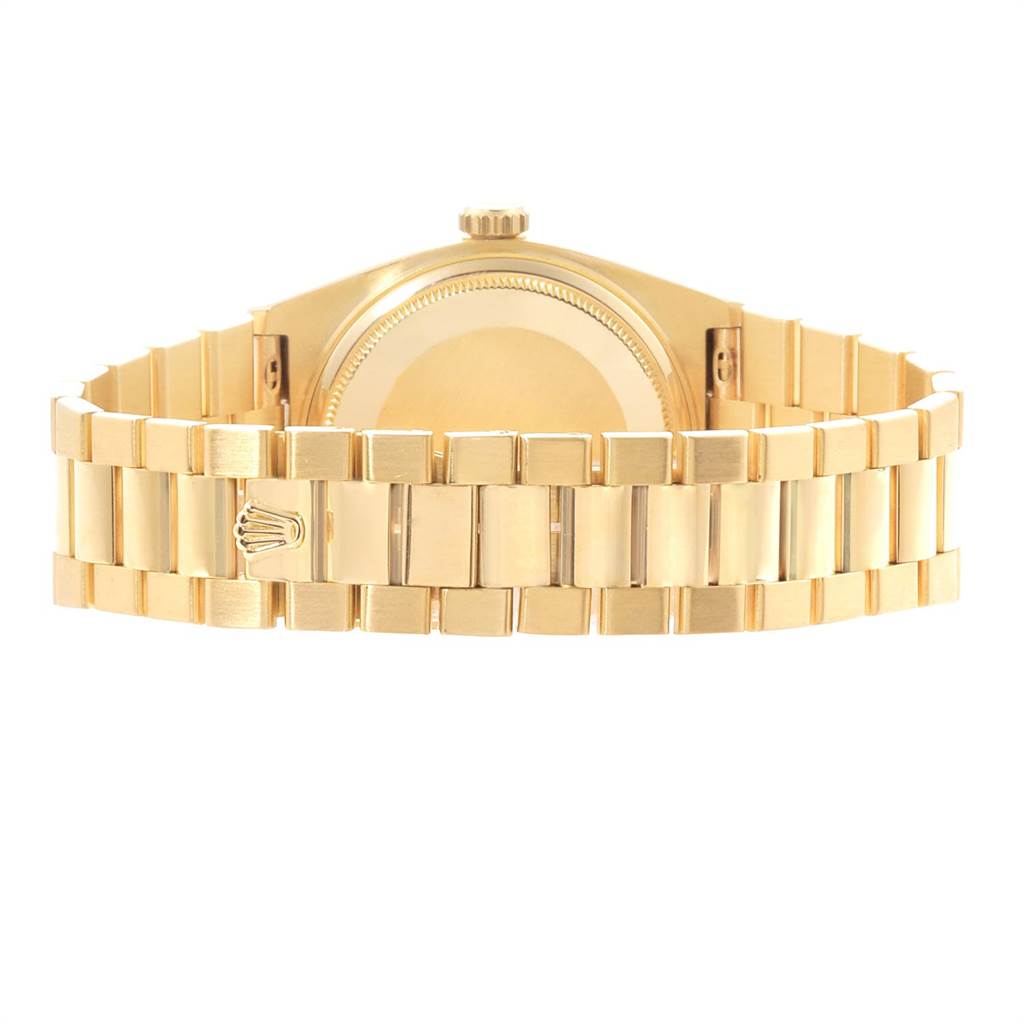 The image shows the back view of a Rolex President 19018 Men
s Yellow Gold Champagne Dial 19018 Men
s Yellow Gold Champagne Dial model watch, highlighting the gold bracelet and case-back.