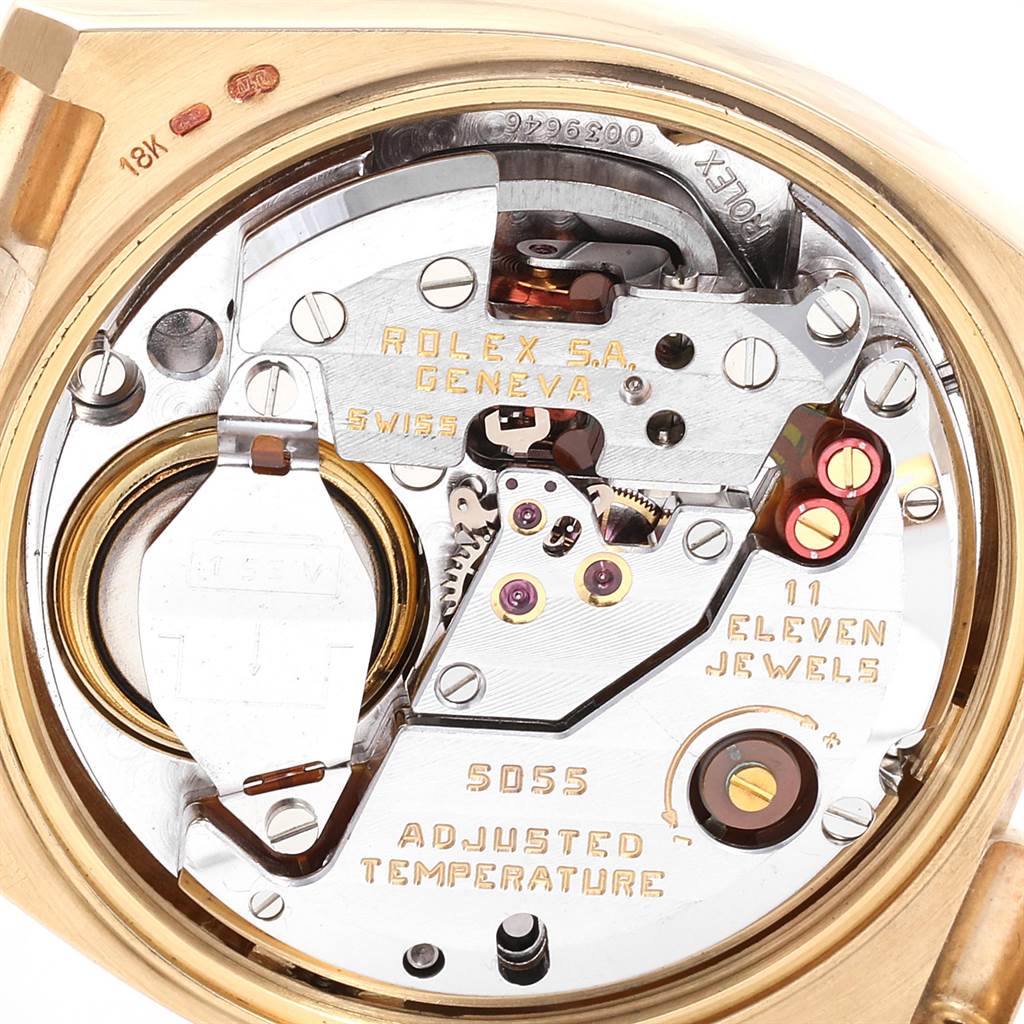 The image shows the movement of a Rolex President 16240 Men
s Yellow Gold Champagne Dial 16240 Men
s Yellow Gold Champagne Dial model watch, specifically highlighting the intricate components and engravings on the back.