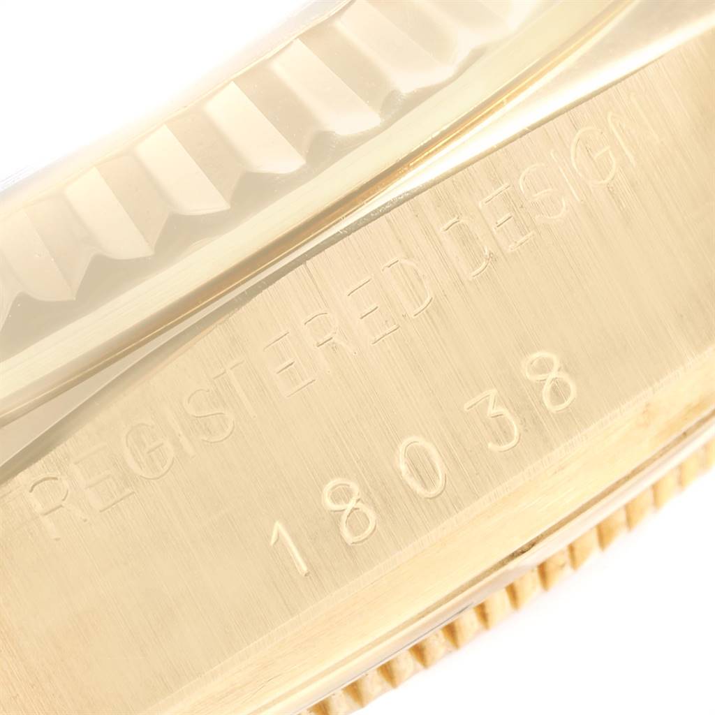 The image shows a close-up of the side profile of a Rolex President 18038 Men's Yellow Gold Blue Dial 18038 Men's Yellow Gold Blue Dial model watch, specifically focusing on the engraved serial number.