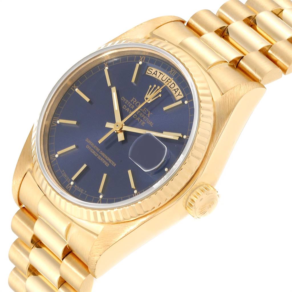 The Rolex President 18038 Men's Yellow Gold Blue Dial 18038 Men's Yellow Gold Blue Dial model watch is shown at an angle, displaying its blue dial, gold case, and gold bracelet.