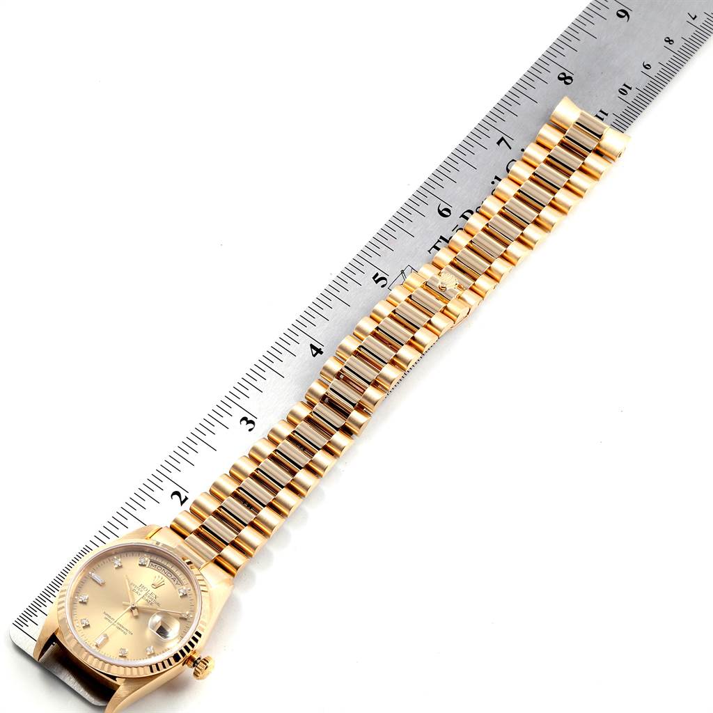 The image shows a Rolex President 18238 Men
s Yellow Gold Champagne Dial 18238 Men
s Yellow Gold Champagne Dial model watch, displaying the full bracelet and face, alongside a ruler for measurement.
