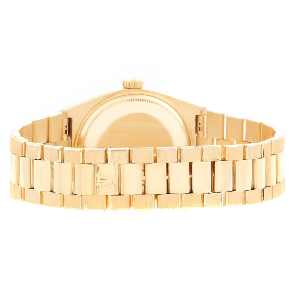 The image shows the back view of a Rolex President 14418 Men
s Yellow Gold Brown Dial 14418 Men
s Yellow Gold Brown Dial model watch, focusing on the bracelet and the case back.