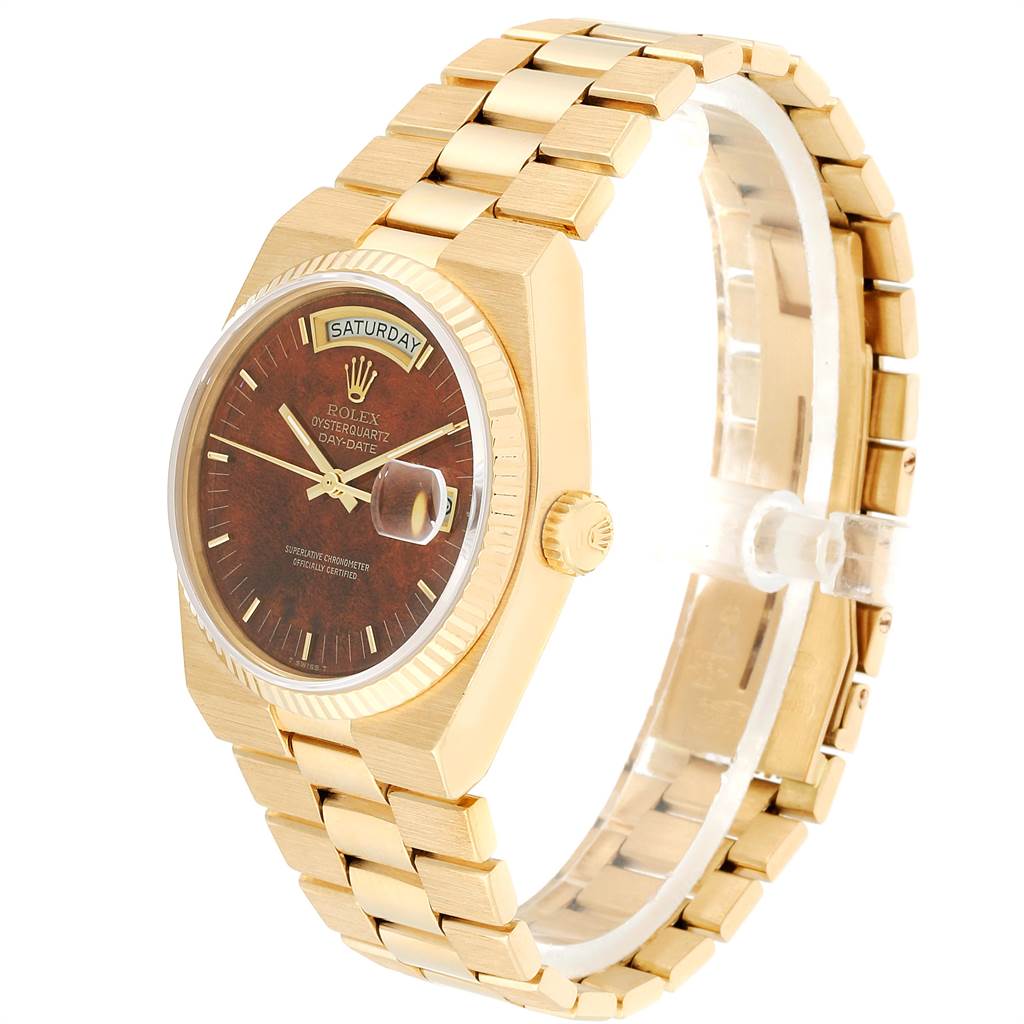 The image shows a side view of a Rolex President 14418 Men
s Yellow Gold Brown Dial 14418 Men
s Yellow Gold Brown Dial model watch, highlighting its gold bracelet and brown dial with a day-date display.