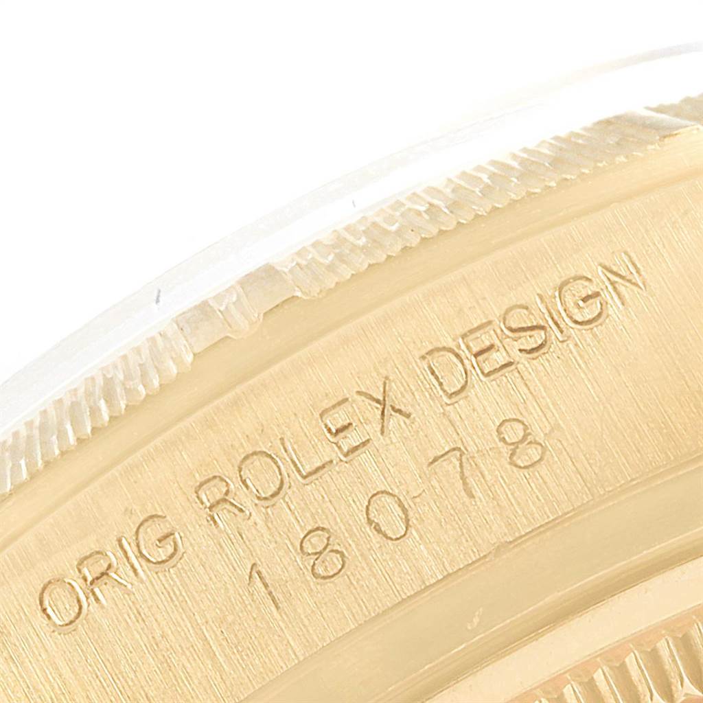 This close-up image shows the engraved inner bezel of a Rolex President 18078 Men
s Yellow Gold Black Dial 18078 Men
s Yellow Gold Black Dial model watch.